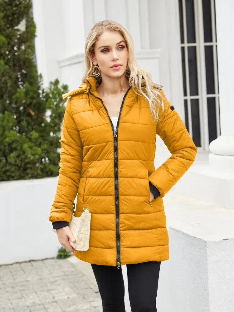 Women's waterproof parka with detachable hat and long sleeves, ideal for autumn and winter; featuring a loose fit and full-length zipper.