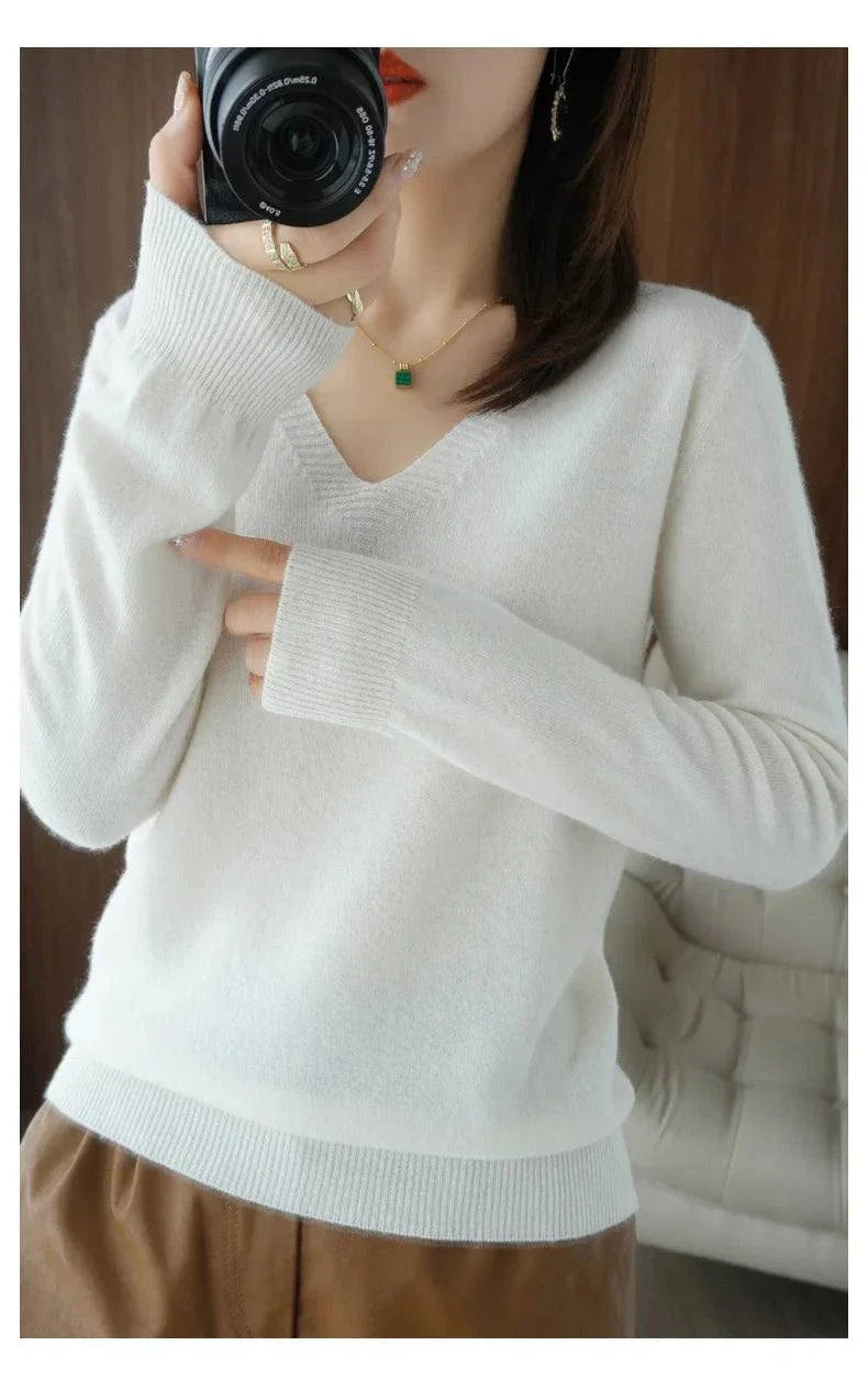 Cashmere women's V-neck pullover sweater with long sleeves and intricate lace neck detailing.