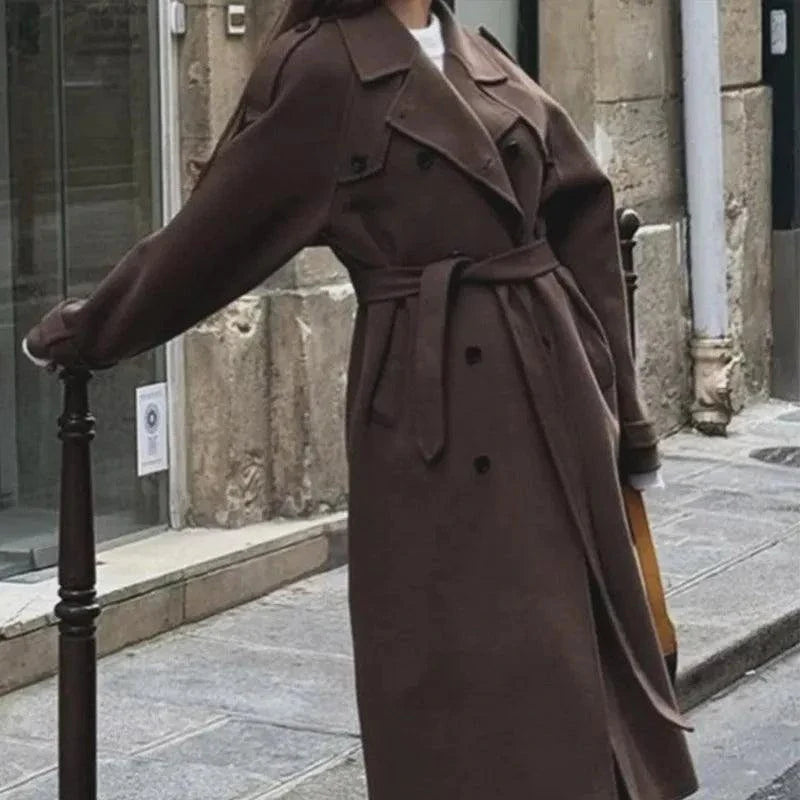 Elegant brown woolen overcoat with double-breasted design and adjustable belt.