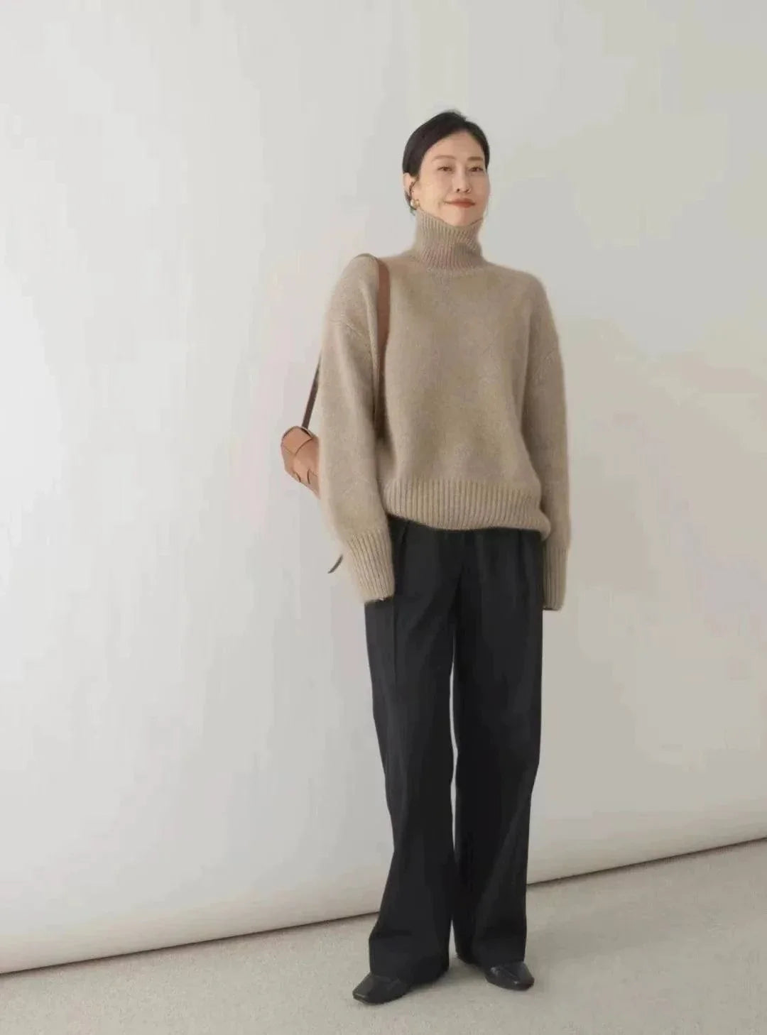 Women's loose turtleneck cashmere sweater, winter wool jumper, elegant and minimalist design.