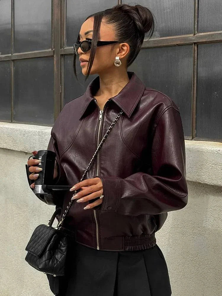 Vintage lapel leather jacket for women, chic solid design with long sleeves, pockets, and a short coat style, perfect for autumn fashion streetwear.